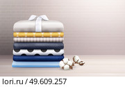 Ironed clothes and colorful linen stack decorated with cotton branch realistic composition vector illustration. Clothes Stack Realistic Composition. Стоковая иллюстрация, агентство Ingram Publishing / Фотобанк Лори