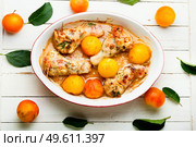 Chicken leg stuffed with mushroom and cherry plum. Baked meat dish with fruit. Chicken drumstick stuffed with plum. Стоковое фото, агентство Ingram Publishing / Фотобанк Лори