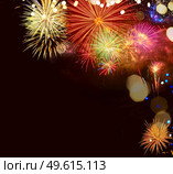 Fireworks explosions on black with copy space, celebrating New Year holiday. Fireworks explosions on black. Стоковое фото, агентство Ingram Publishing / Фотобанк Лори