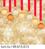 chrismas balls on golden background with sparkles. Стоковое фото, агентство Ingram Publishing / Фотобанк Лори