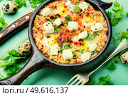 Israeli shakshuka made from fried eggs, tomato, minced lamb and hot spices.. Israeli shakshuka,scrambled eggs. Стоковое фото, агентство Ingram Publishing / Фотобанк Лори