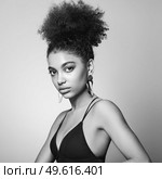 Beautiful smiling girl with curly hairstyle stock photo Women, African Ethnicity, Fashion Model, One Woman Only. Black and white photo. Стоковое фото, агентство Ingram Publishing / Фотобанк Лори
