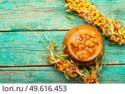 Fresh sea buckthorn jam. Autumn berry jam.Copy space. Glass jar with sea buckthorn jam. Стоковое фото, агентство Ingram Publishing / Фотобанк Лори