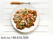Turkey meat in cheese breading with mushroom sauce. Turkey schnitzel with fried mushrooms. Стоковое фото, агентство Ingram Publishing / Фотобанк Лори