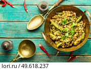 Kitchari,stewed rice with mash and spices fried in oil,. Kitchari, a spicy vegetarian dish. Стоковое фото, агентство Ingram Publishing / Фотобанк Лори