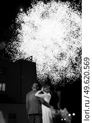 fiery pieces of a fire show against a dark sky and thunderstorms. Стоковое фото, агентство Ingram Publishing / Фотобанк Лори