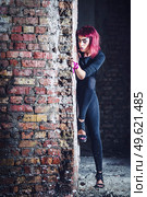 girl model in black with pink hair in an abandoned building. Стоковое фото, агентство Ingram Publishing / Фотобанк Лори