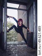 girl model in black with pink hair in an abandoned building. Стоковое фото, агентство Ingram Publishing / Фотобанк Лори