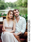 a boat trip for a guy and a girl along the canals and bays of the river overgrown with wild willows. Стоковое фото, агентство Ingram Publishing / Фотобанк Лори