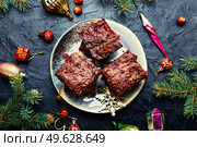 Panforte, an unusually delicious Christmas treat made from dried fruits and nuts. Italian Christmas pastries. Panforte is a traditional Italian Christmas torte. Стоковое фото, агентство Ingram Publishing / Фотобанк Лори