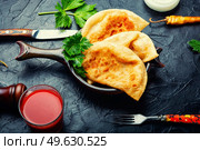 Chebureks making yeast dough, stuffing with minced beef. Delicious appetizing, chebureks. Стоковое фото, агентство Ingram Publishing / Фотобанк Лори