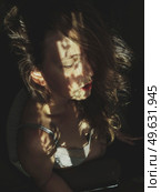 Artistic portrait of a young woman with retro shadow play style. Стоковое фото, агентство Ingram Publishing / Фотобанк Лори