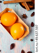 blue wooden background with lemon and cinnamon, anise, dog rose . flat lay . Стоковое фото, агентство Ingram Publishing / Фотобанк Лори