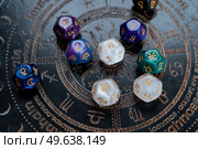 Horoscope zodiac circle with divination dice. Fortune telling and astrology predictions concept, magic rituals and exoteric experience. Zodiac horoscope with divination dice. Стоковое фото, агентство Ingram Publishing / Фотобанк Лори