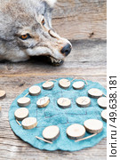 Handmade runes for fortunetelling over leather chart. Handmade runes for fortunetelling. Стоковое фото, агентство Ingram Publishing / Фотобанк Лори