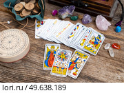 Fortune telling on tarot cards, used Marseille Tarot deck by unknown artist published first in 1709. Fortune telling on tarot cards. Стоковое фото, агентство Ingram Publishing / Фотобанк Лори