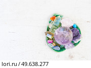 Gemstones mix for relax and meditation. Magic ball and minerals for Reiki life balance, healing Crystal Ritual, Witchcraft, spiritual esoteric practice, top view with copy space. Healing crystals concept. Стоковое фото, агентство Ingram Publishing / Фотобанк Лори