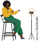 Woman is recording video on smartphone. African american girl is broadcasting live, podcasting using phone. Record video, live online podcast. Female blogger broadcasting, recording video blog. African american girl is broadcasting live, podcasting, recording video blog using smartphone. Стоковая иллюстрация, агентство Ingram Publishing / Фотобанк Лори