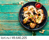 Homemade baked lean pork roll with apples and dates. Roasted meat roll.Copy space. Meat loaf with dates and apples,space for text. Стоковое фото, агентство Ingram Publishing / Фотобанк Лори