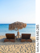 summer beach with sunbeds, Mykonos island, Greece. Mykonos island, Greece. Стоковое фото, агентство Ingram Publishing / Фотобанк Лори