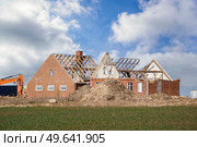 House demolition in rural surroundings with a green lawn and blue sky. Стоковое фото, агентство Ingram Publishing / Фотобанк Лори