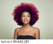 Beauty portrait of African American girl with colorful dyed afro hair. Beautiful black woman. Cosmetics, makeup and fashion. Стоковое фото, агентство Ingram Publishing / Фотобанк Лори