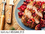 Appetizing piece of pork loin in a fruity marinade. Fried meat with pomegranate.. Pork loin in pomegranate marinade. Стоковое фото, агентство Ingram Publishing / Фотобанк Лори