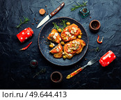 Thin layer of meat, breaded in breadcrumbs with cheese, olives and tomato. Meat dish - schnitzel. Meat schnitzel with cheese, olives and tomato. Стоковое фото, агентство Ingram Publishing / Фотобанк Лори
