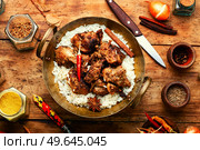 Vinegar marinated pork stewed in Indian spices, vindaloo.. Pork vindaloo, a popular Indian dish. Стоковое фото, агентство Ingram Publishing / Фотобанк Лори