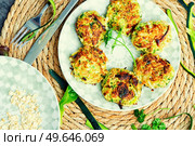 Vegan cutlets or fritter from zucchini, oatmeal and greens.. Diet zucchini cutlets. Стоковое фото, агентство Ingram Publishing / Фотобанк Лори