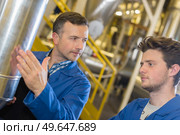 portrait of an apprentice in factory. Стоковое фото, агентство Ingram Publishing / Фотобанк Лори