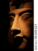 bust of pharaoh Echnaton (Akhenaten, aka Amenhotep IV) around black background . cloes up. Стоковое фото, агентство Ingram Publishing / Фотобанк Лори