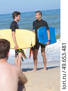 young fit bodyboarders on beach. Стоковое фото, агентство Ingram Publishing / Фотобанк Лори