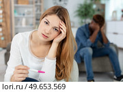 worried mixed-race couple have an unplanned pregnancy. Стоковое фото, агентство Ingram Publishing / Фотобанк Лори