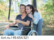 smiling disabled man looking and his girlfriend. Стоковое фото, агентство Ingram Publishing / Фотобанк Лори