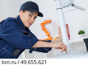 concept of woman fixing a swivel chair. Стоковое фото, агентство Ingram Publishing / Фотобанк Лори