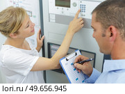 ladys hand using a dial pad on a machine. Стоковое фото, агентство Ingram Publishing / Фотобанк Лори