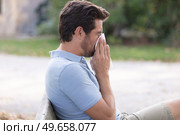 man with allergy or an infection sneezing. Стоковое фото, агентство Ingram Publishing / Фотобанк Лори