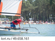 professional waterman training on lake with catamaran. Стоковое фото, агентство Ingram Publishing / Фотобанк Лори