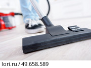 Closeup of vacuum on hard flooring. Стоковое фото, агентство Ingram Publishing / Фотобанк Лори