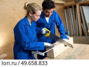 two workers in carpentry workshop. Стоковое фото, агентство Ingram Publishing / Фотобанк Лори