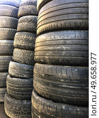 Old worn-out tires for cars. It is assembled for recycling. Стоковое фото, фотограф Ярославский Максим / Фотобанк Лори