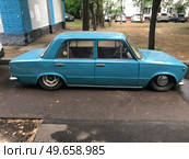 An old VAZ-2101 with an air suspension in the Moscow courtyard in the parking lot. Russia. Moscow. 13.06.25. Редакционное фото, фотограф Ярославский Максим / Фотобанк Лори