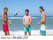 the boys playing beach volleyball. Стоковое фото, агентство Ingram Publishing / Фотобанк Лори