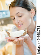 a woman and the smell of cheese. Стоковое фото, агентство Ingram Publishing / Фотобанк Лори