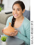 beautiful woman holdingwith wooden essential oil aroma diffuser. Стоковое фото, агентство Ingram Publishing / Фотобанк Лори