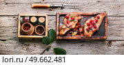 Baked meat ribs with cherry. Juicy bbq rib steak. Стоковое фото, агентство Ingram Publishing / Фотобанк Лори
