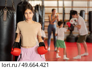 Girl posing during training in boxing gloves. Стоковое фото, фотограф Яков Филимонов / Фотобанк Лори