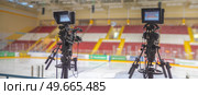 video cameras for live broadcast of sports competition in the ice arena. Стоковое фото, агентство Ingram Publishing / Фотобанк Лори