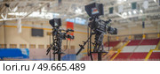 video cameras for live broadcast of sports competition in the ice arena. Стоковое фото, агентство Ingram Publishing / Фотобанк Лори